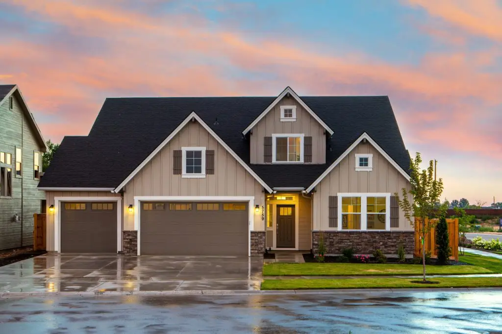 brown-and-gray-painted-house-in-front-of-road